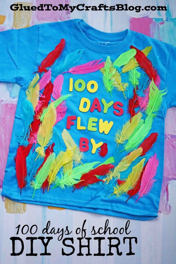 100th day of school shirt ideas include this teal shirt that has brightly colored feathers glued to it and stickers that read 100 Days Flew By (100th day of school shirt ideas)