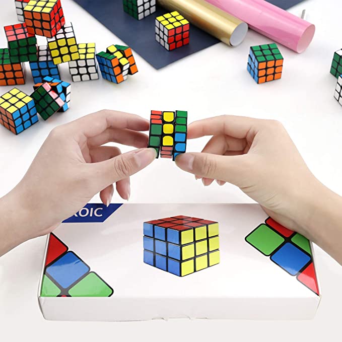 Hands solving Rubix Cube style puzzle cube, as an example of inexpensive gift ideas for students